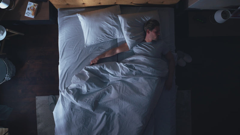 An overhead shot of a man sleeping, with infographics stating that 1 billion people are affected by sleep issues worldwide, and the global diagnosis rate is only 10-20%. This highlights the health problem that a smart ring is designed to monitor.
