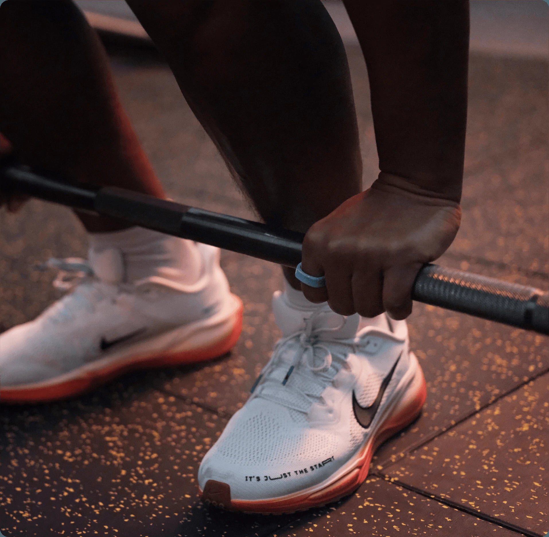 Person wearing smart ring lifting weights in gym, fitness and health tracking.