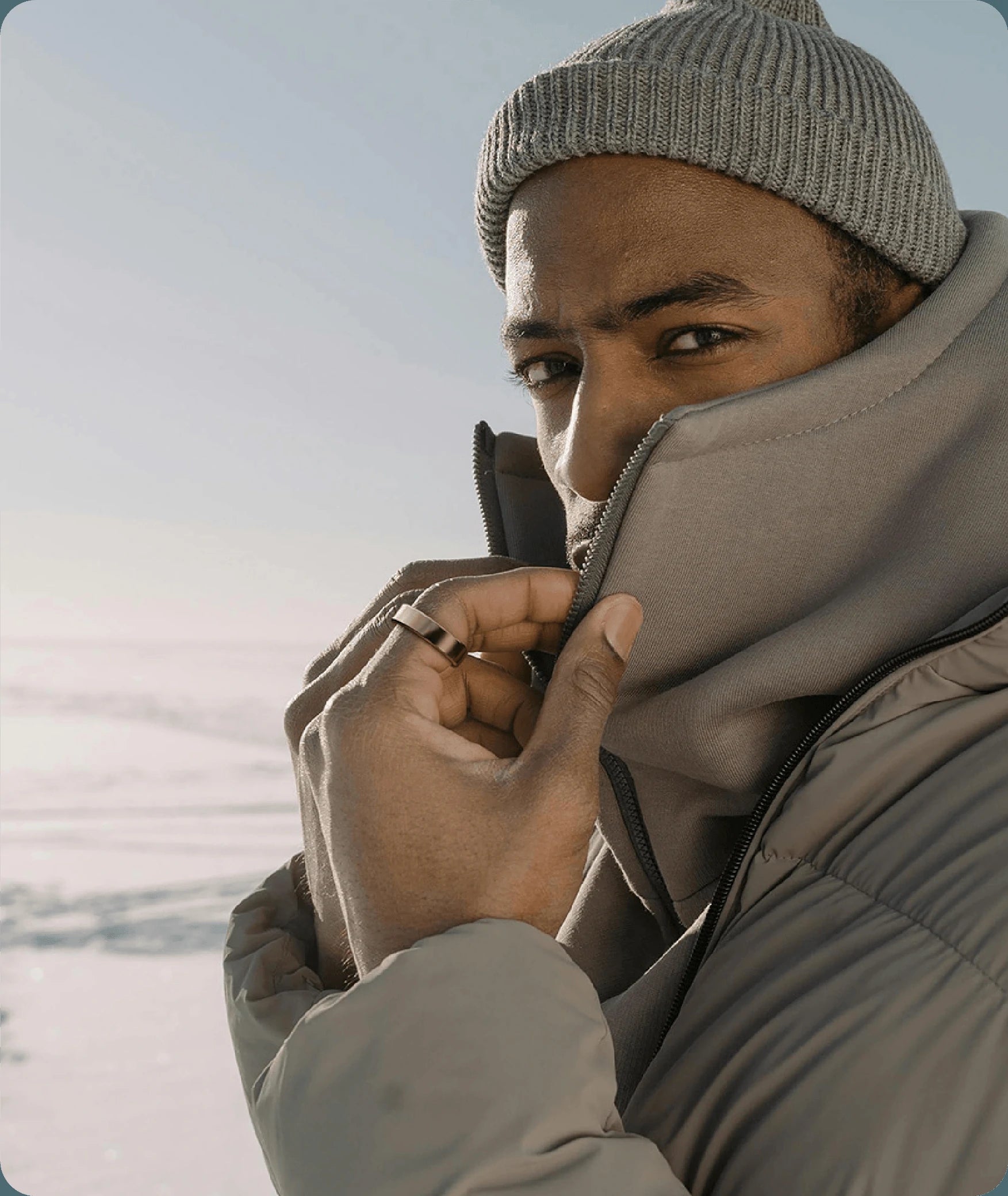 Gold smart ring on man's finger, sleek design, modern wearable technology